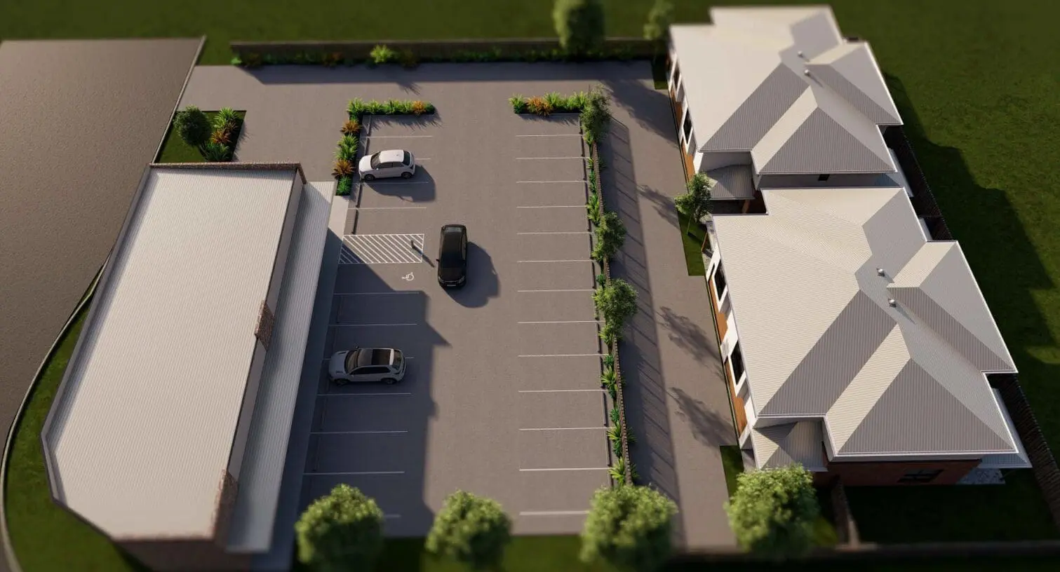 Parking area between two white-roofed structures