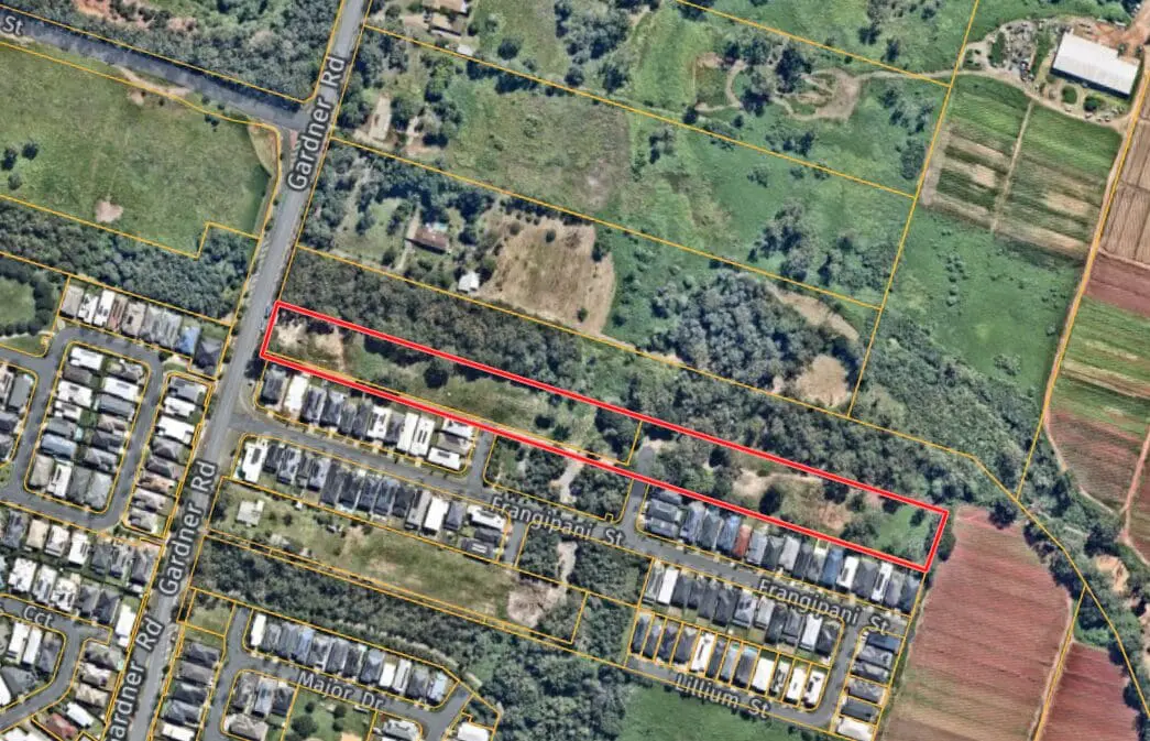 Aerial view of residential and farmland area.