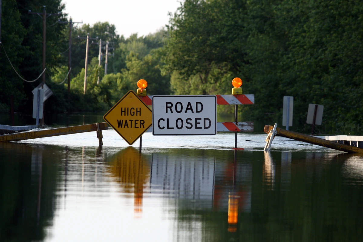Flood barriers blocking submerged road